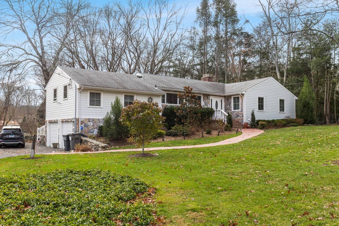 Exquisite and luxurious, this completely remodeled North Stamford ranch sits on 1.
