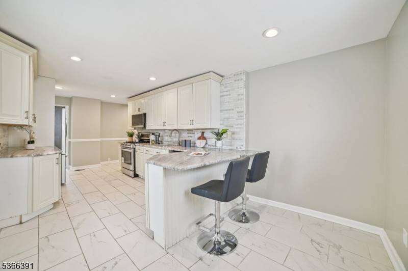 Custom built colonial with 5 bedrooms and 3 full baths.