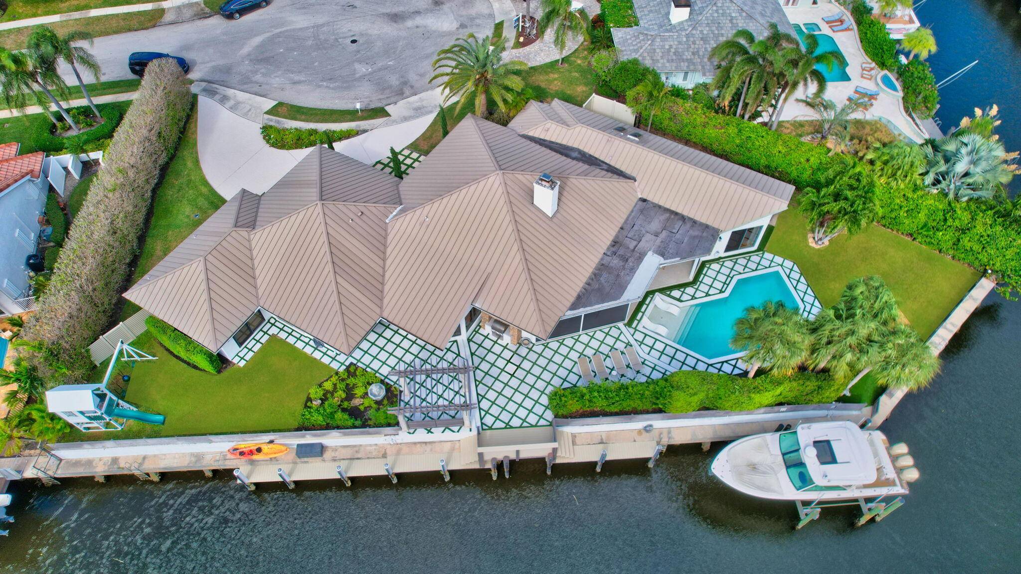 THIS STUNNING CUSTOM BUILT WATERFRONT HOME IS SITUATED ON A PREMIER POINT LOT IN PRESTIGIOUS BOCA BAY COLONY !