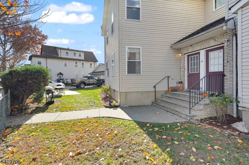 Discover this rare side by side two family duplex, offering the privacy and feel of a single family home with exceptional income potential ideal for owner occupants seeking to offset ...