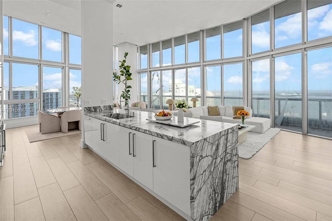 Icon Brickell APT 4101 is a corner unit that that offers 180 degrees of ocean views and ceilings so tall you ll need scaffolding to change a lightbulb.