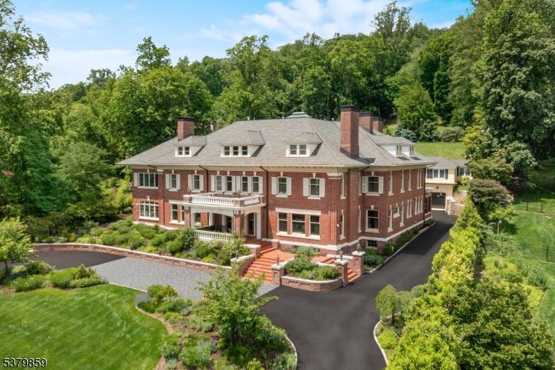 Step into a world of refined elegance at Daybreak, a meticulously restored estate offering eight bedrooms, eight full baths, and one half bath, nestled on 1.