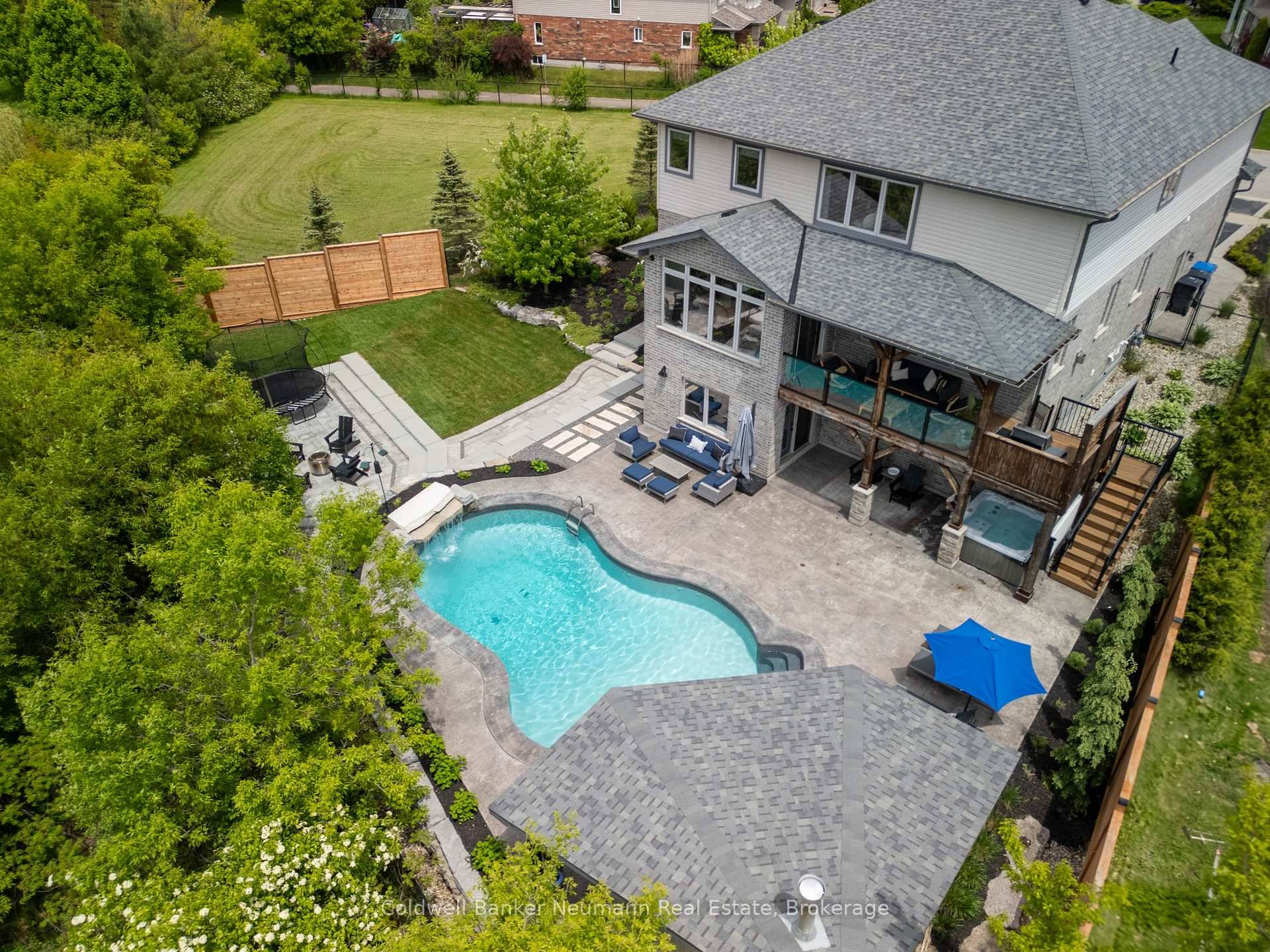 Situated on an expansive pie shaped lot surrounded by nature, this stunning residence is thoughtfully crafted with every detail in mind.