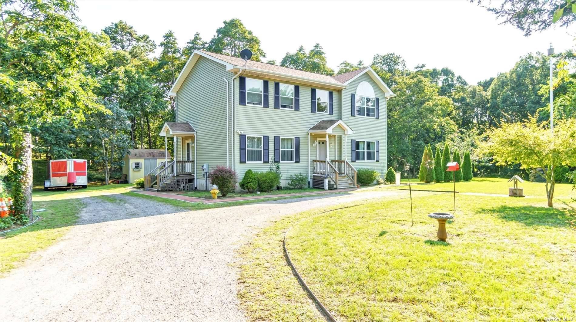 Southampton Home on 1. 1 acre wooded corner lot.