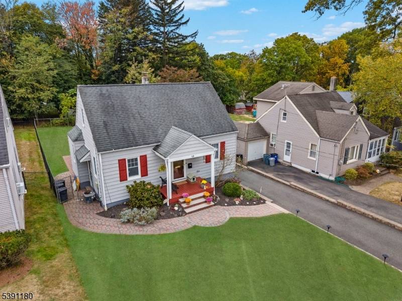 Welcome to this beautifully maintained East facing Cape Cod, perfectly situated in one of Essex County's most desirable zip codes Livingston, NJ.