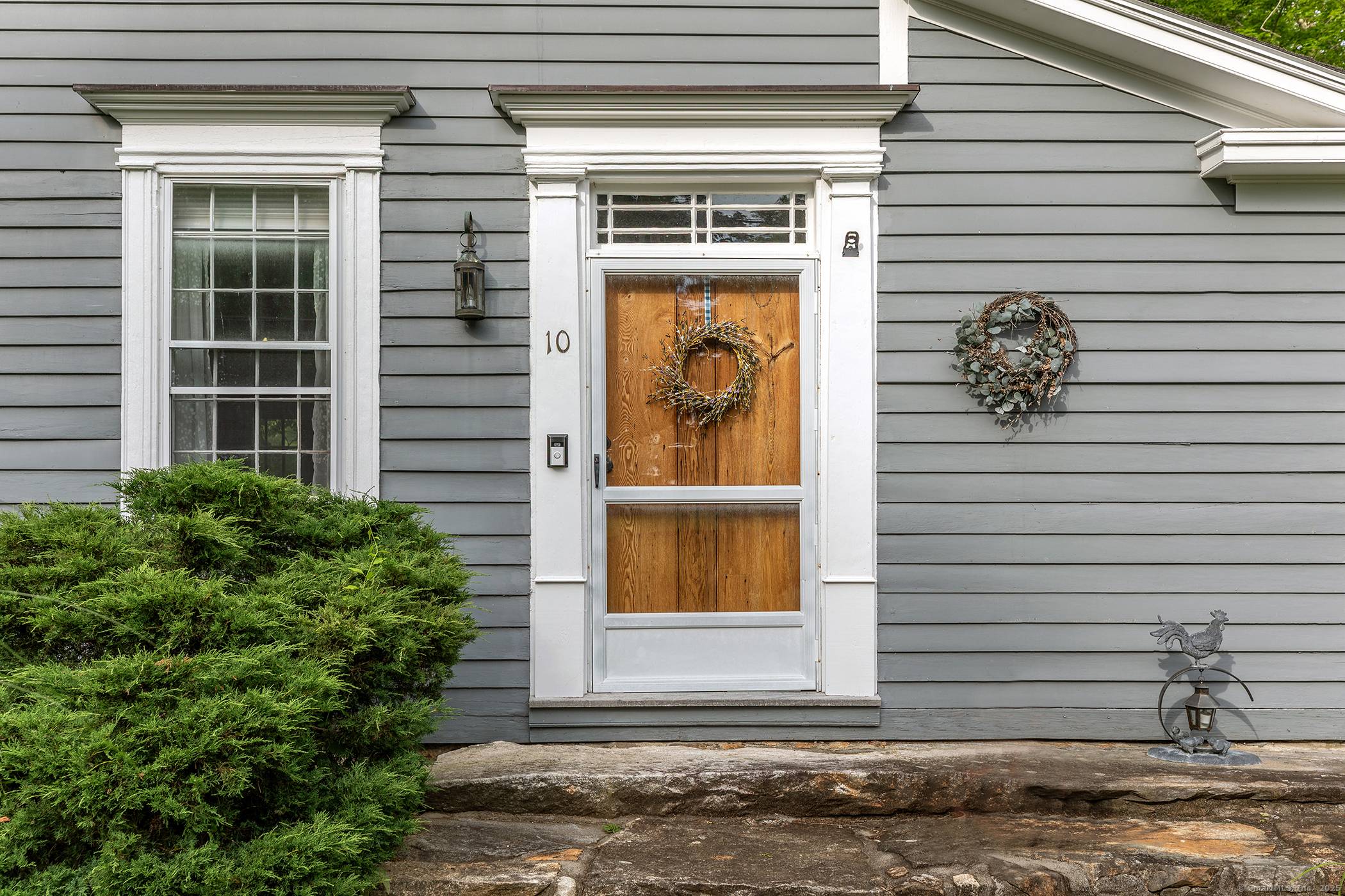 This classic side hall colonial is elegant yet charming and filled with character including gorgeous wide oak floors and a chestnut fireplace surround.