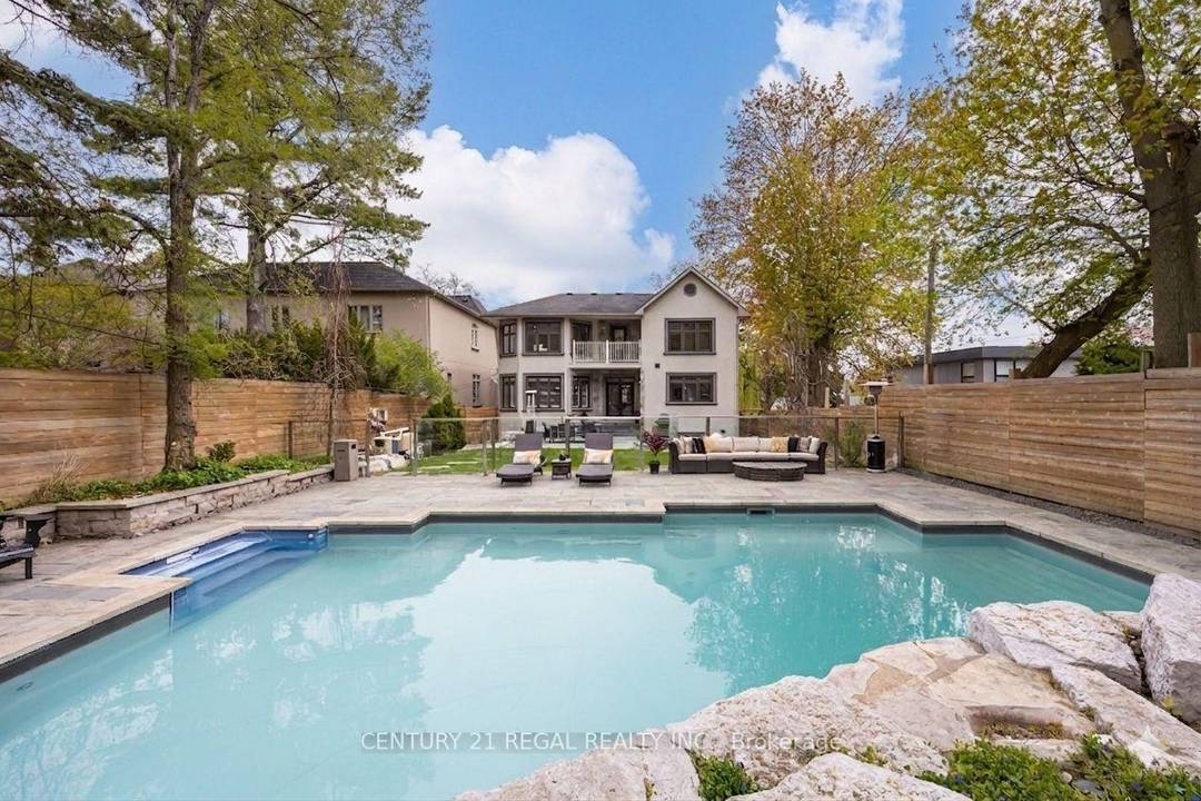Welcome to this exceptional custom built residence offering approximately 3, 200 sq ft of refined living space on an impressive 50 x 160 ft deep lot.