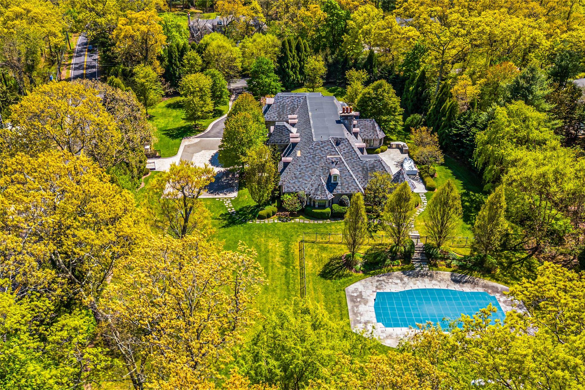 This grand, gated estate blends timeless elegance with modern convenience, showcasing meticulous European craftsmanship throughout.