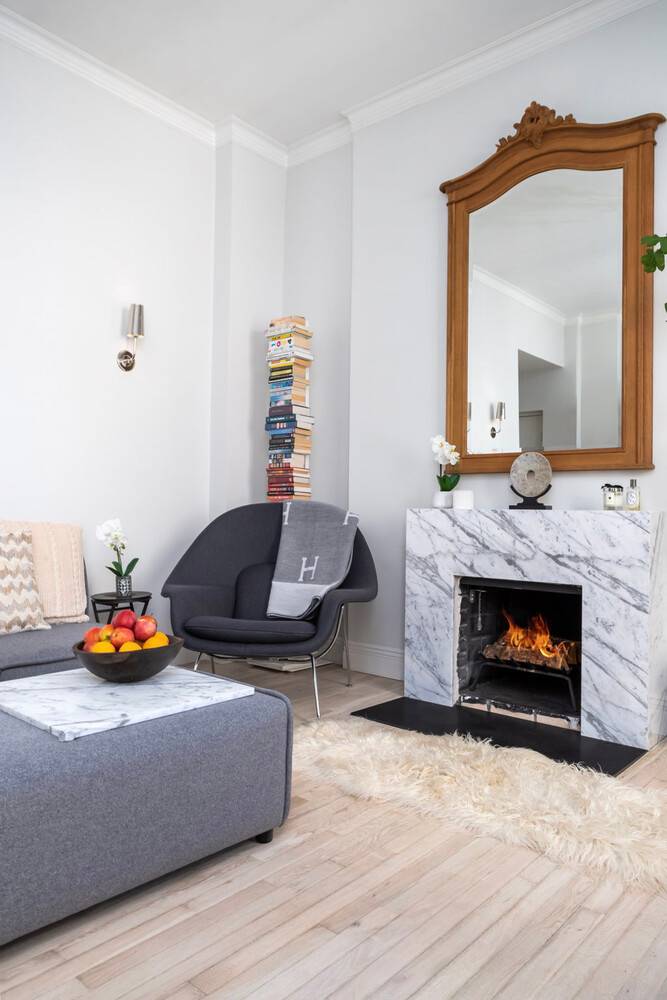 Light filled and impeccably renovated top floor UES Residence with high ceilings and wood burning fireplace.