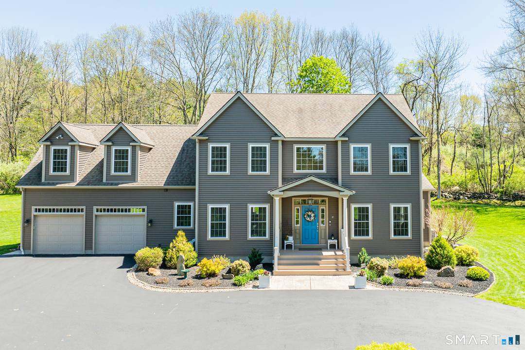 Enter the long tree lined paved driveway to a Pristine Colonial on 8.