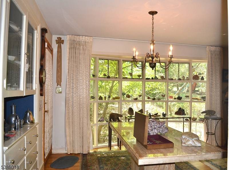 Tucked away on a half acre in the Wastena Terrace section in West Ridgewood sits this spacious home of over 3, 600 SF.