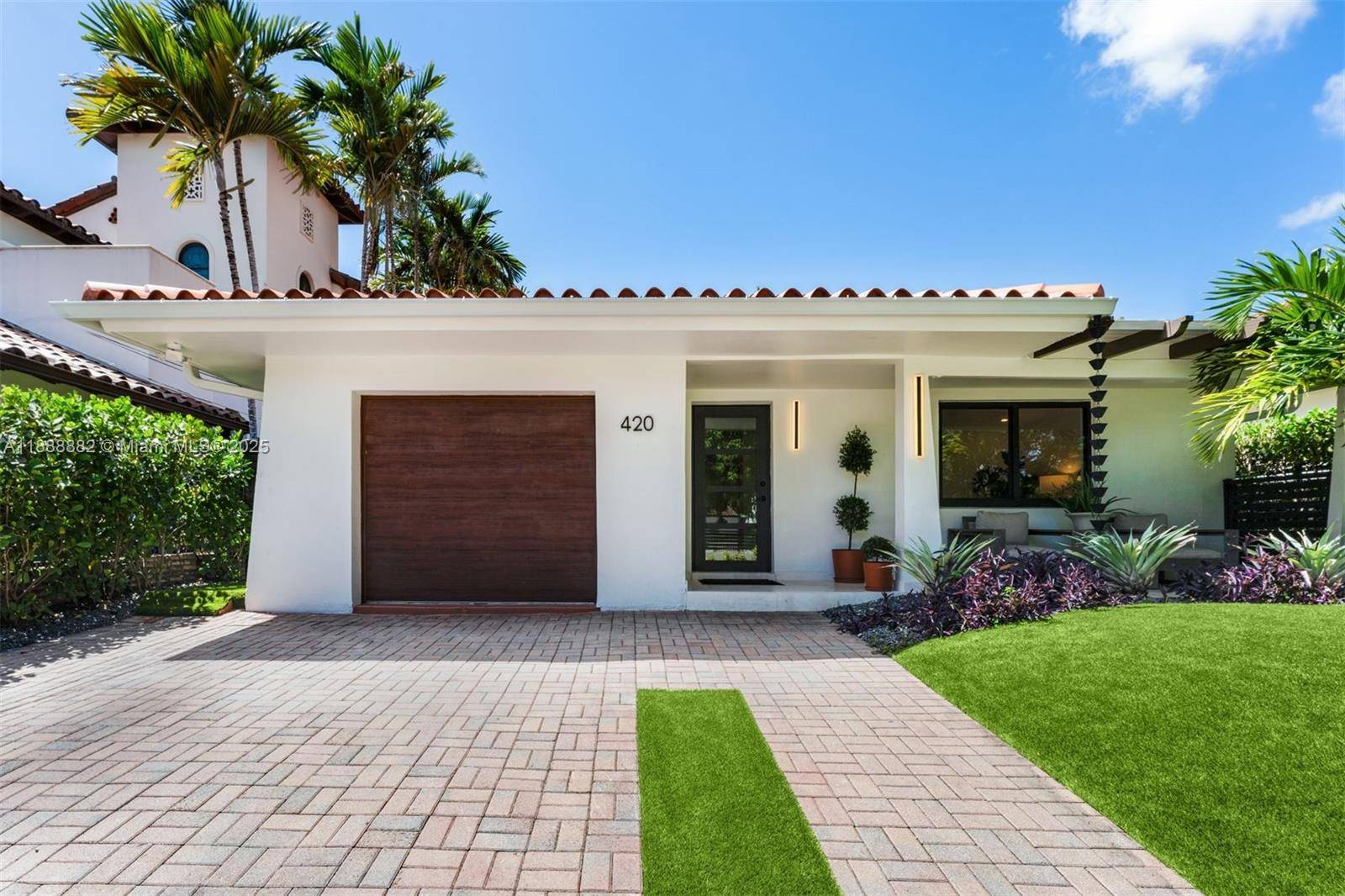 Gated and completely renovated home in The Roads, one of Miami s most historic and desirable neighborhoods.
