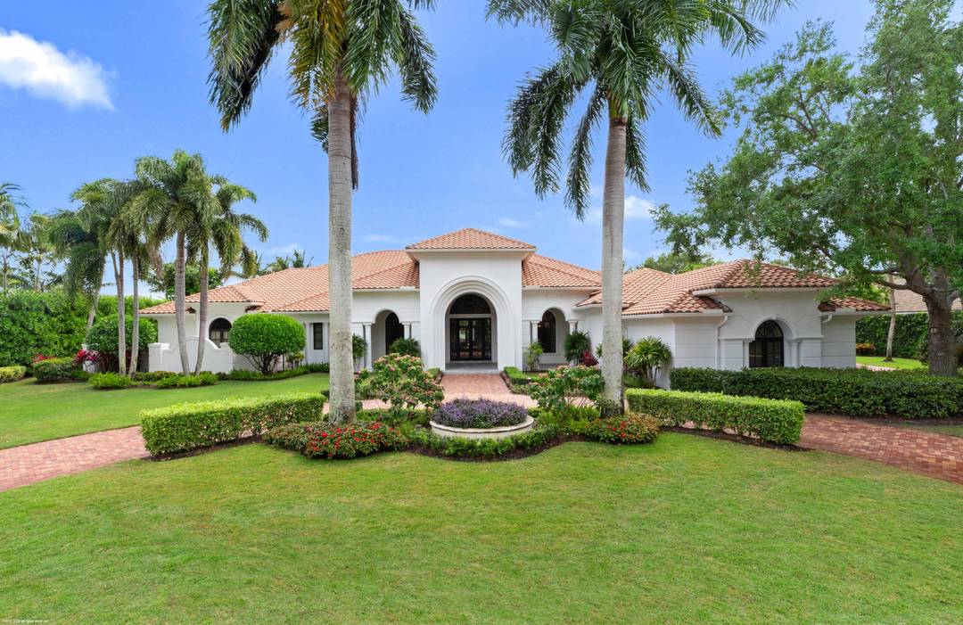 Experience the pinnacle of luxury living in this magnificent estate home nestled within one of Palm Beach Gardens' most exclusive golf communities Old Palm Golf Club.