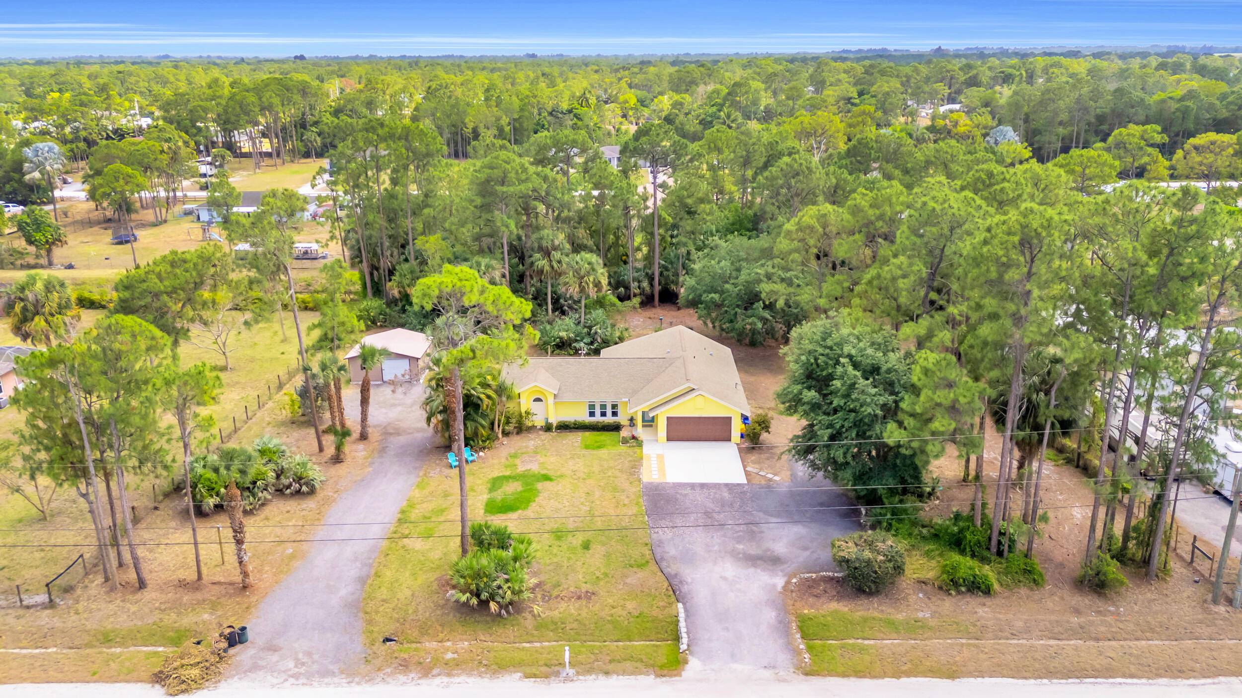 Your serene home awaits on over an acre of sanctuary setting !