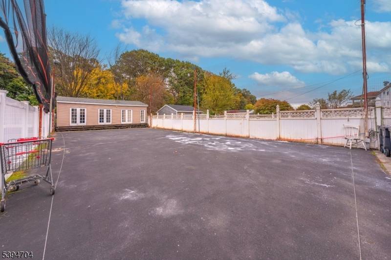 Discover a rare opportunity on a massive 35x186 lot in Newark's desirable North Ward, just steps from Branch Brook Park.
