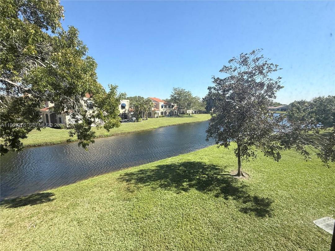 Beautiful corner unit with stunning water views from the living room, balcony, and master bedroom.