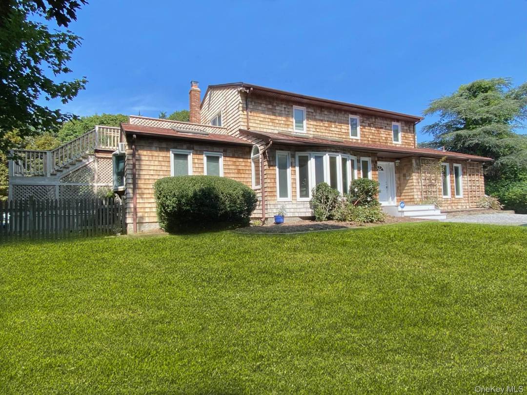 Enjoy summer in the Hamptons in this lovely home nestled at the end of a cul de sac.