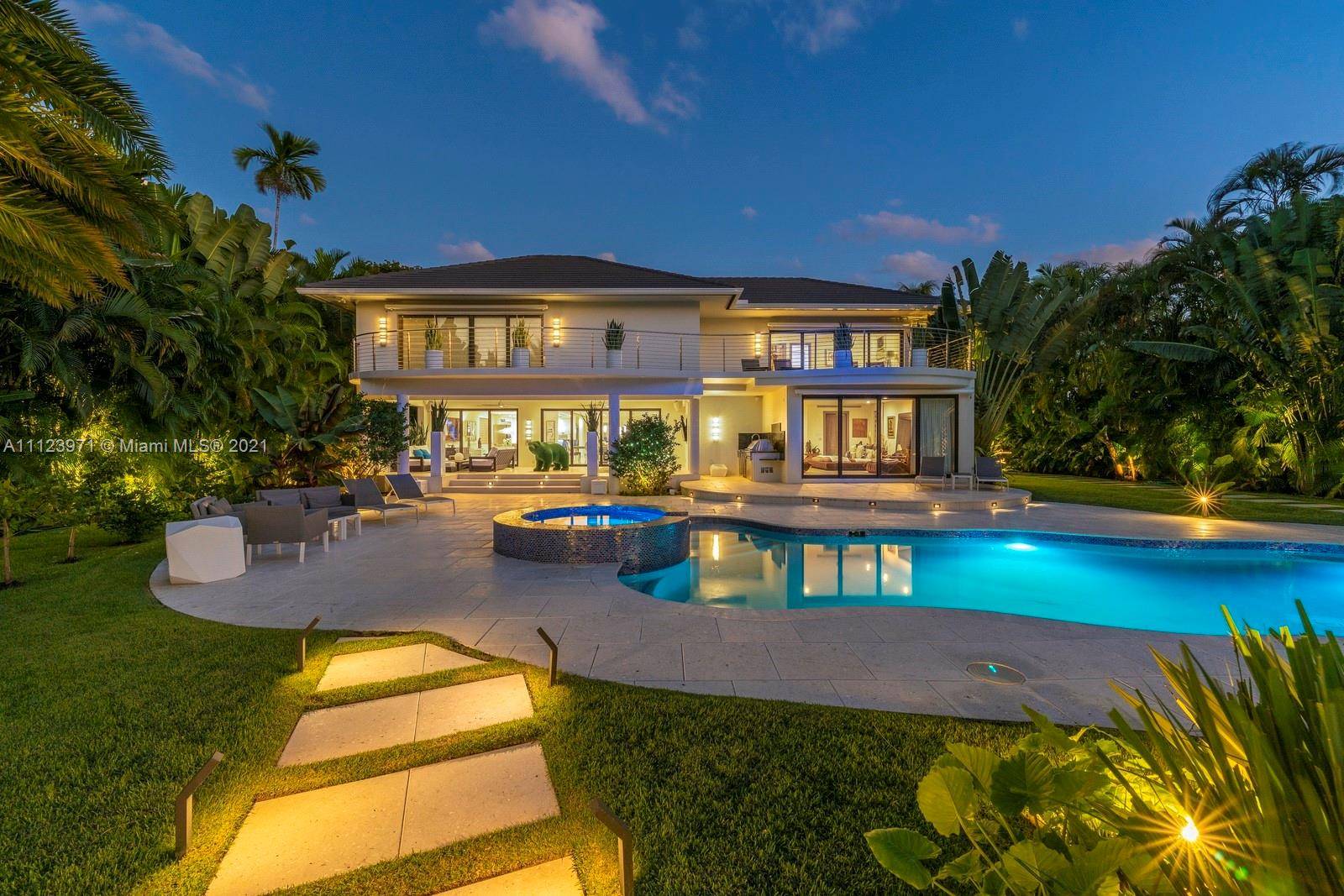 Treat yourself to the ultimate coastal lifestyle in this immaculate residence desirably set on a double waterfront lot in Surfside !
