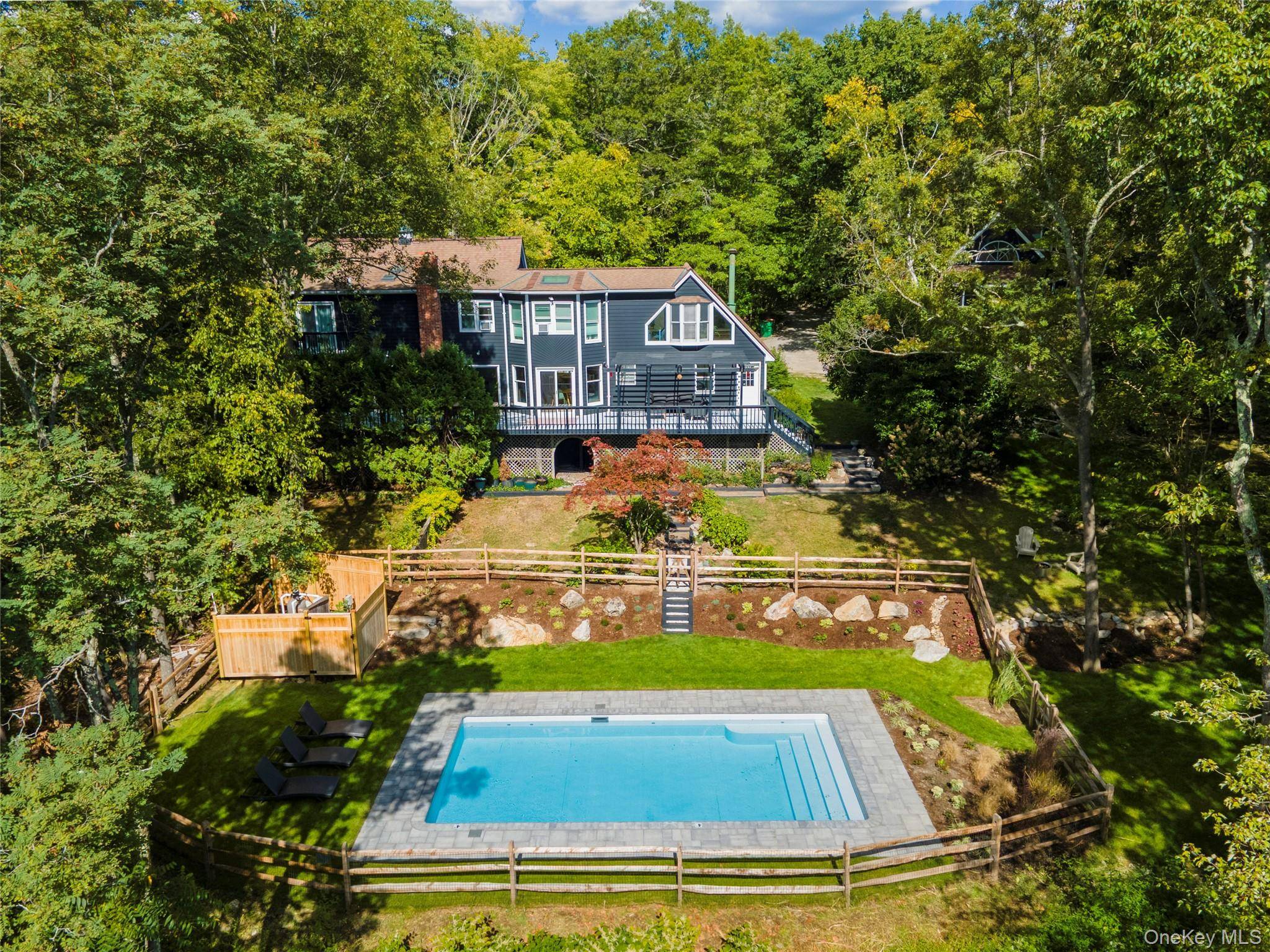 Discover this Hudson Valley retreat with sweeping mountain views, ideally located in the heart of Garrison.