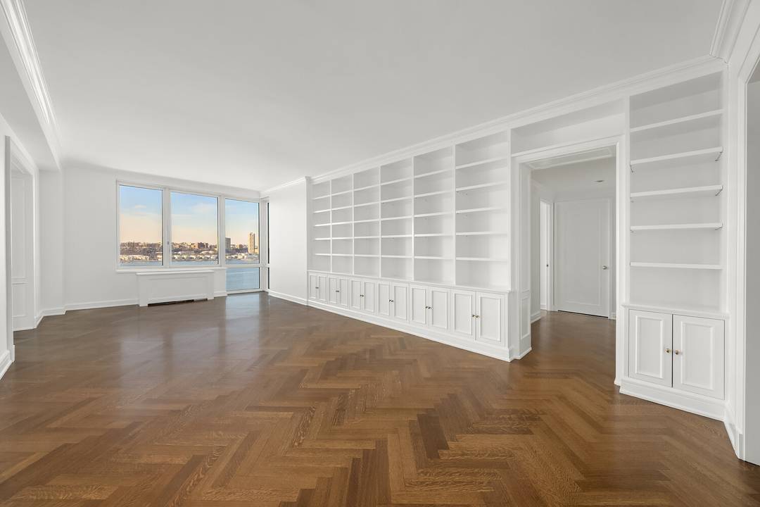 Pristine, fully renovated apartment with sweeping Hudson River and city views.