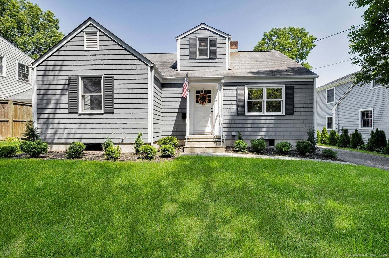 Welcome to 29 Ridgeley Street, a charming Cape Cod style home tucked away on a quiet cul de sac in the heart of Darien.