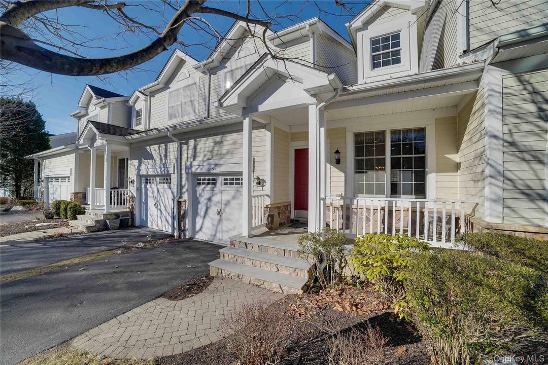Welcome to 25 Augusta Drive, Cortlandt Manor, New York, a beautifully appointed townhouse condominium tucked within the meticulously maintained Hollow Brook Mews community by Toll Brothers, renowned for signature quality, ...