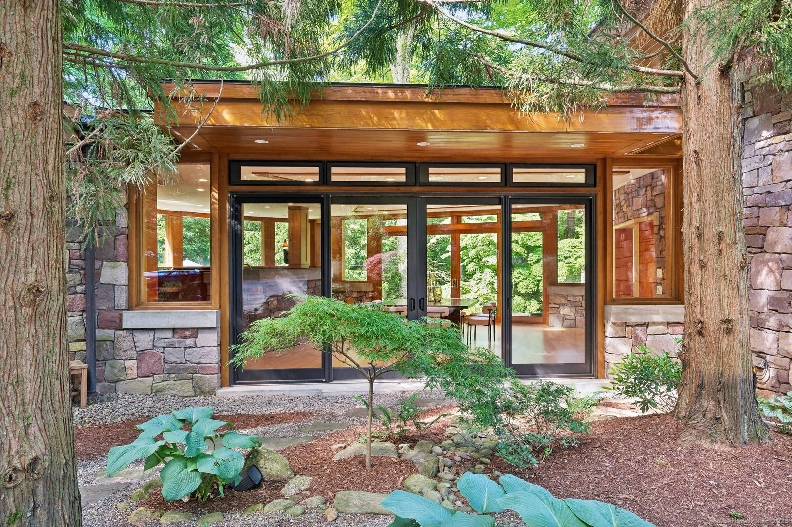 Experience the magic of organic architecture in this stunning John Howe designed masterpiece, where every detail tells a story of harmony and connection with nature.