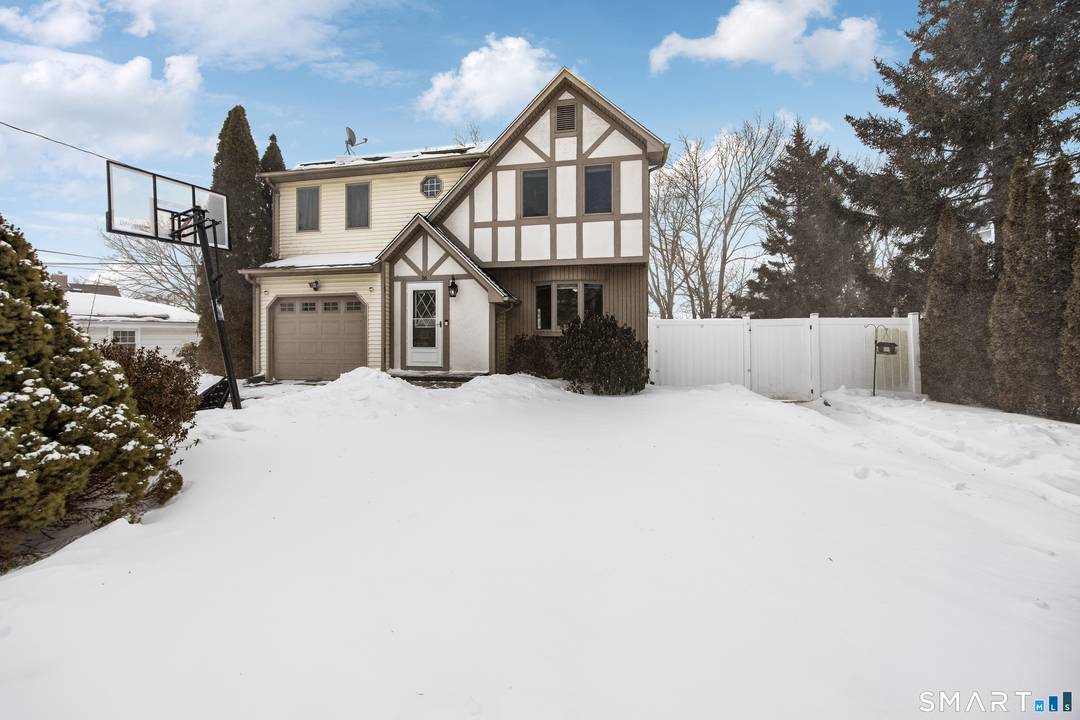 This storybook two story home beautifully blends classic character with warm, inviting curb appeal.