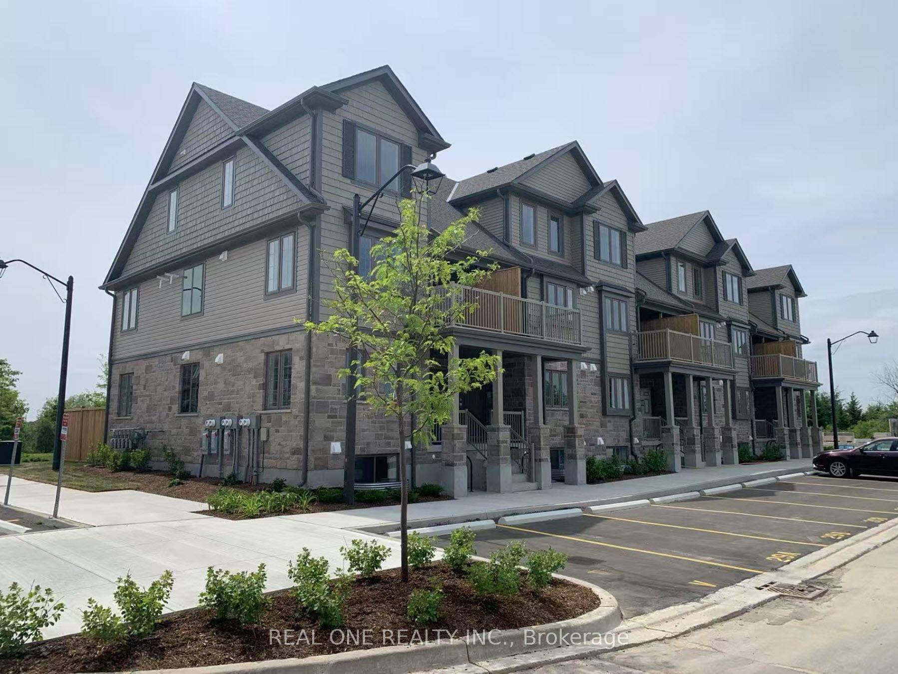 Surround yourself with nature in this sun filled, move in ready condo townhome just steps from Guelph Lake and scenic trails.