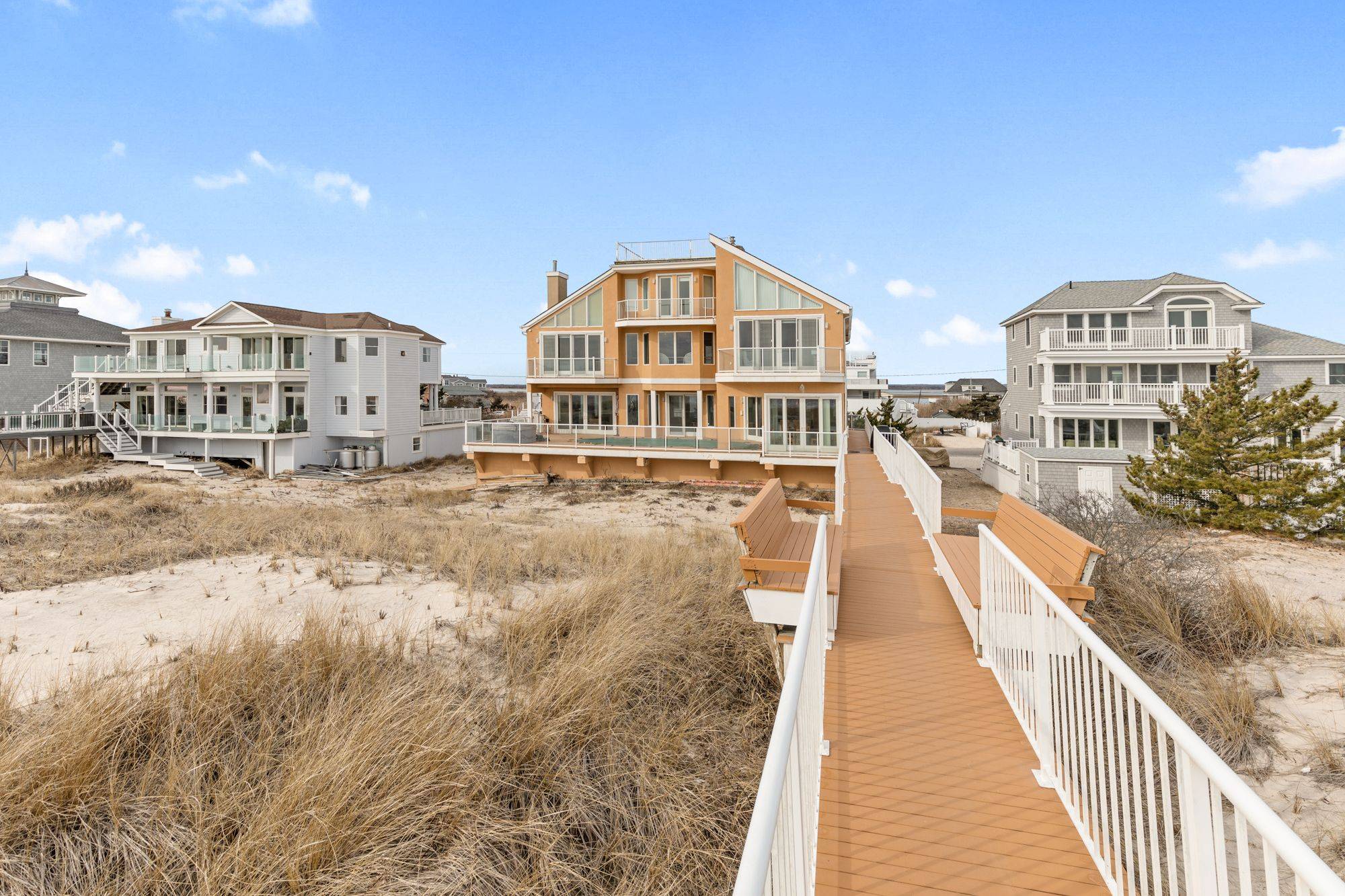 This stunning oceanfront contemporary with over 5, 000 sq feet and Panoramic views of the ocean.