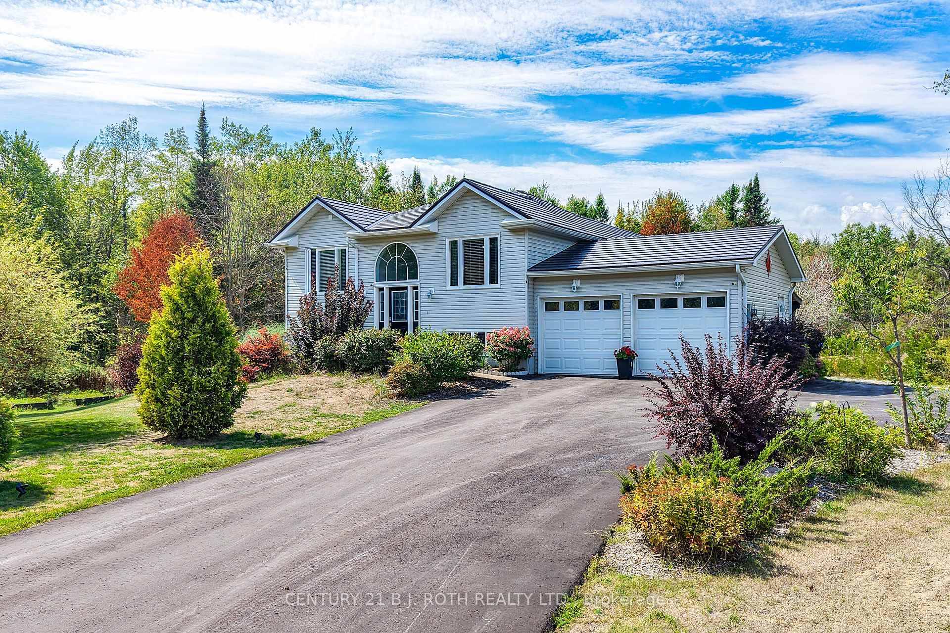 Set on 5 private acres with most of the property blanked with mature trees, this quiet retreat is minutes to Washago's shops, dining, and Hwy access.