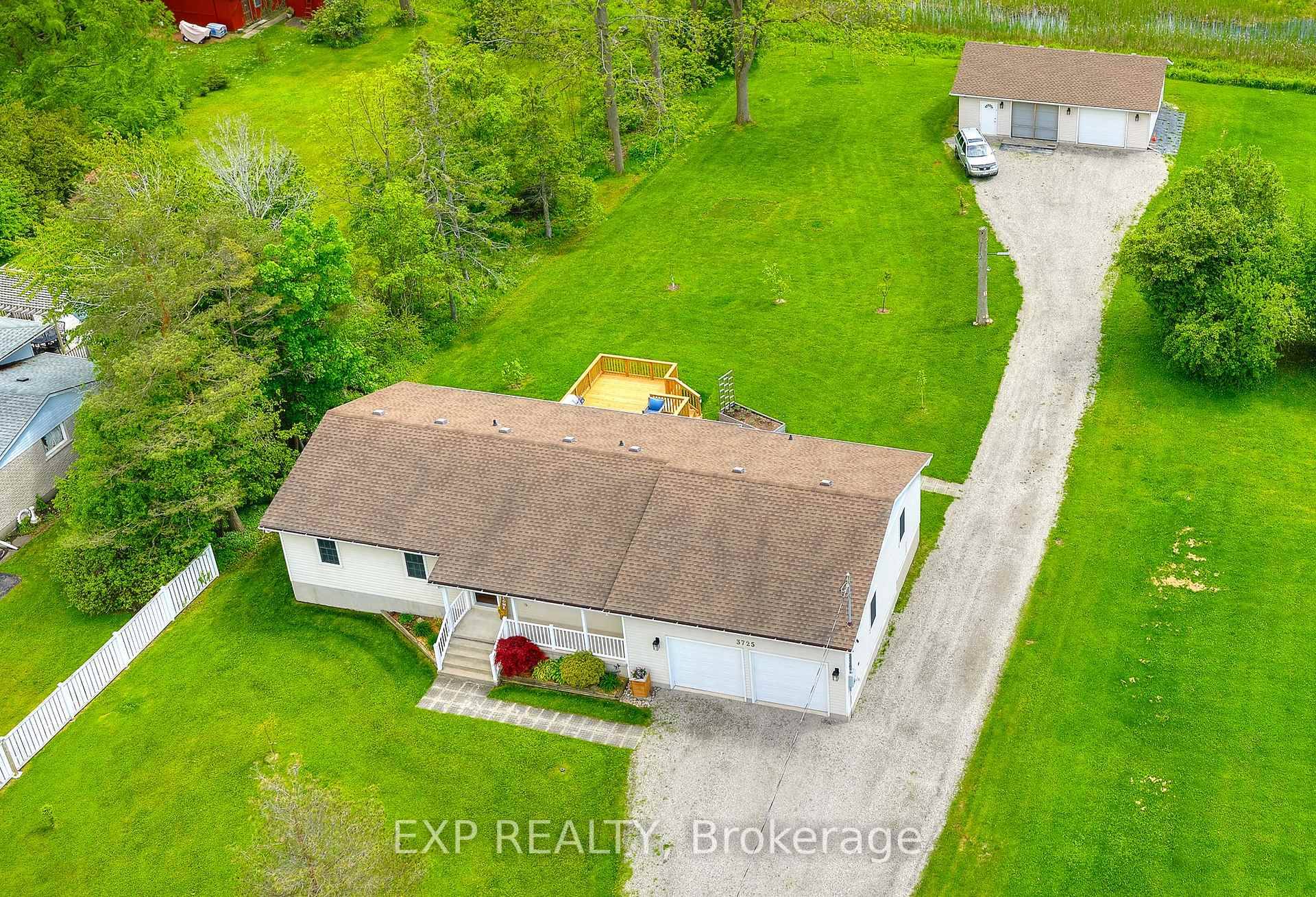 Oversized Bungalow with Heated Workshop, Offering Privacy and All One Level Living !