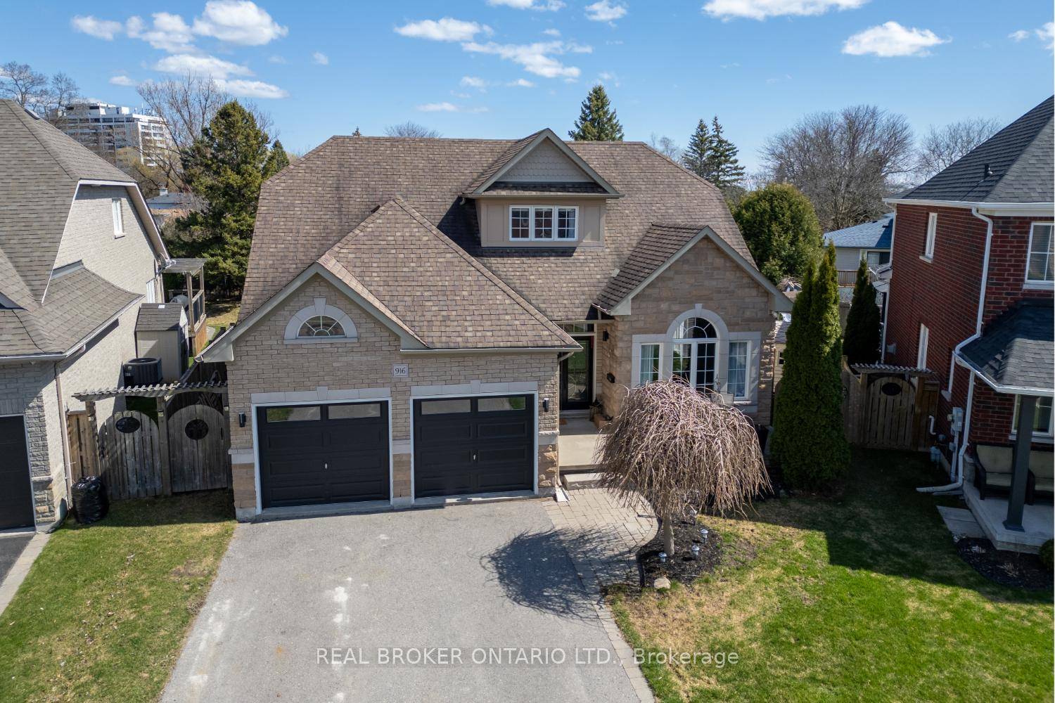This stunning, brick and stone bungaloft, nestled on a premium, pie shaped lot offers incredible curb appeal, a 6 car driveway, and a double garage.