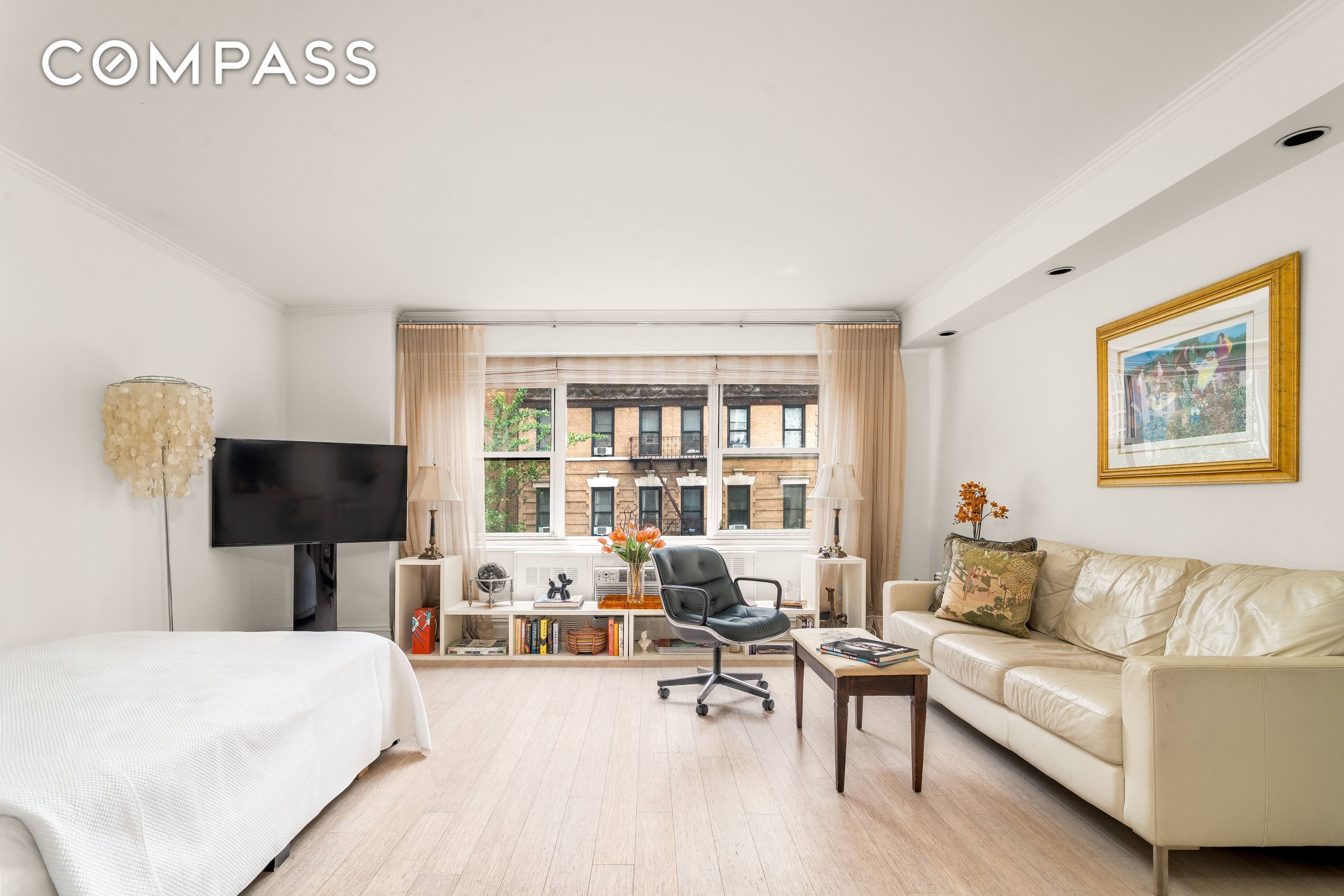 EXCEPTIONAL VALUE ! BRIGHT SOUTH FACING STUDIO with ICONIC VIEWS in FULL SERVICE MIDTOWN EAST CO OP.
