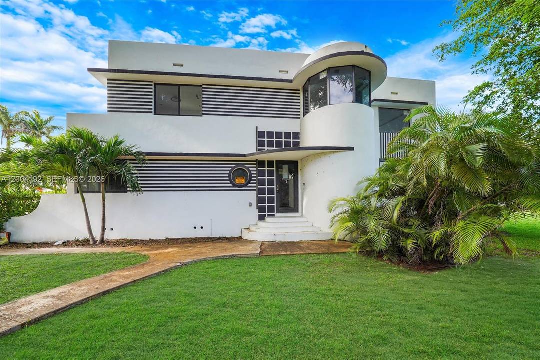 Located in the highly sought after Hollywood Lakes community, directly across from the Hollywood Beach Golf Club on an oversized double lot !