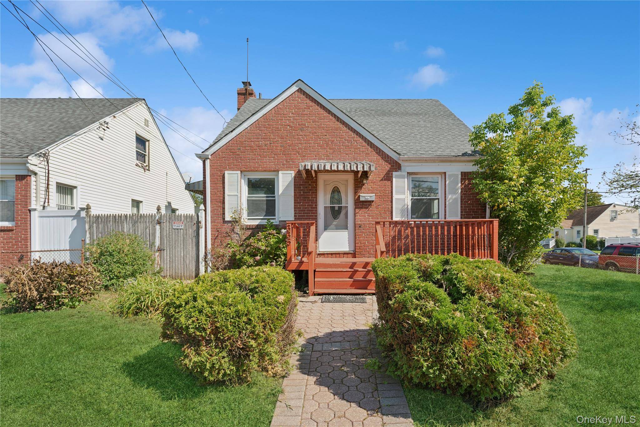 Welcome to this charming Cape home perfectly situated on a desirable corner lot in Uniondale.