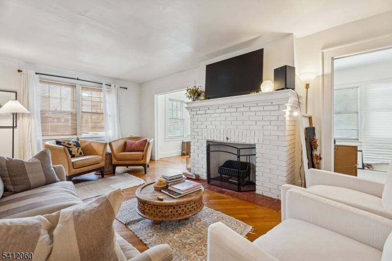Classic Colonial with gabled roofline featuring 4 brs 2 bths in sought after Upper Ivy Hill, Newark.