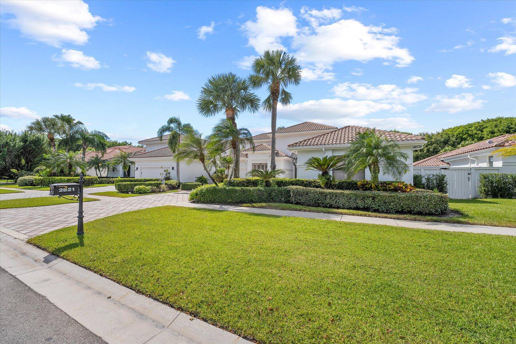 Modern residence in the most perfect setting offering iconic water views one of the best views in Palm Beach Polo.