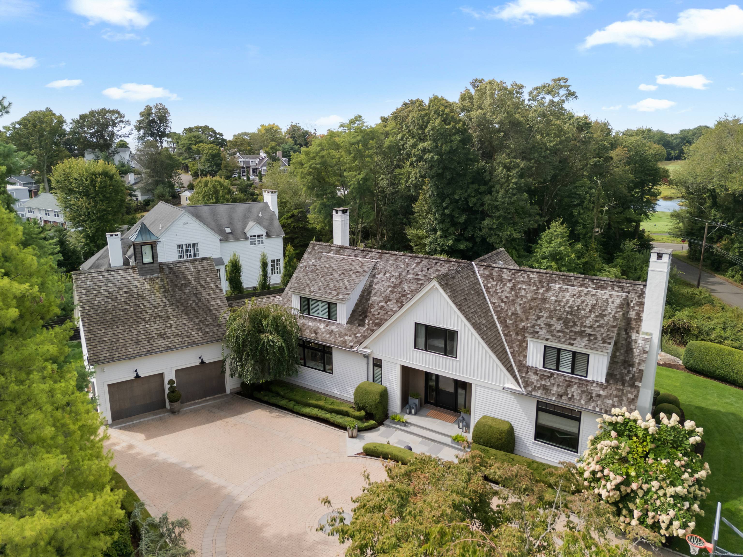 Turnkey luxury in the heart of Pine Orchard's coveted Juniper Point Association.