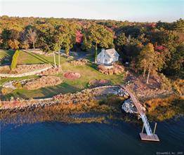 A magnificent property with a dock sits high above Scotts Cove with nearly 500 feet of direct waterfront.