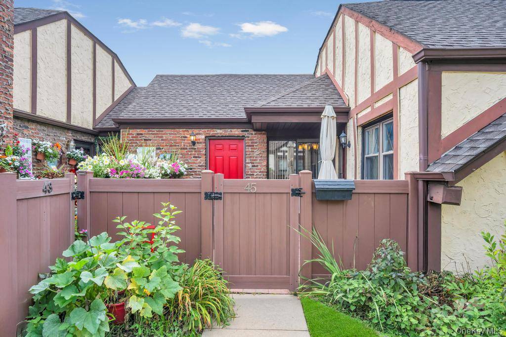 Step into this beautifully updated unique ranch style two bedroom condo featuring its own private gated entrance, charming private patio, and private garage with plenty of storage.