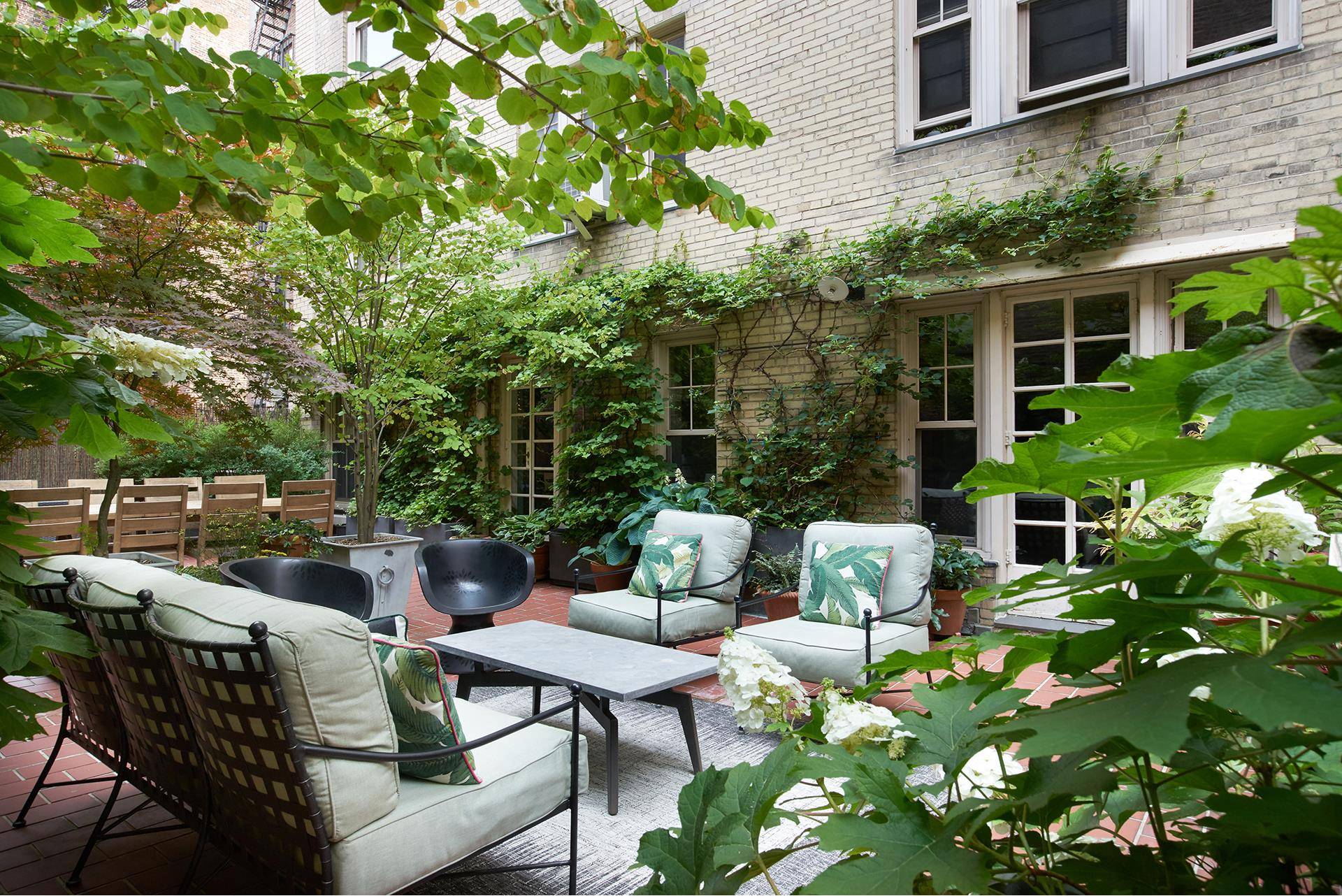A MUST SEE GUT RENOVATED JEWEL BOX TWO BEDROOM TWO BATHROOM WEST VILLAGE FULL SERVICE CONDOMINIUM HOME WITH AN EXTENSIVE PRIVATE GARDEN !