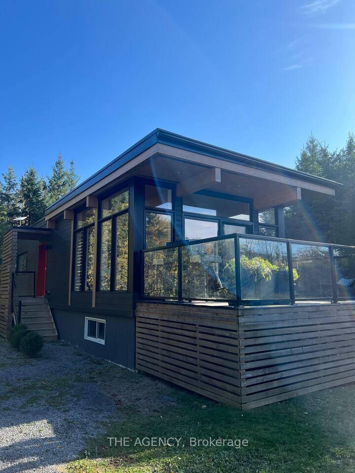 Welcome Home ! This Scandinavian inspired detached 2bedroom home sits on a quiet street surrounded by trees for ultimate privacy.