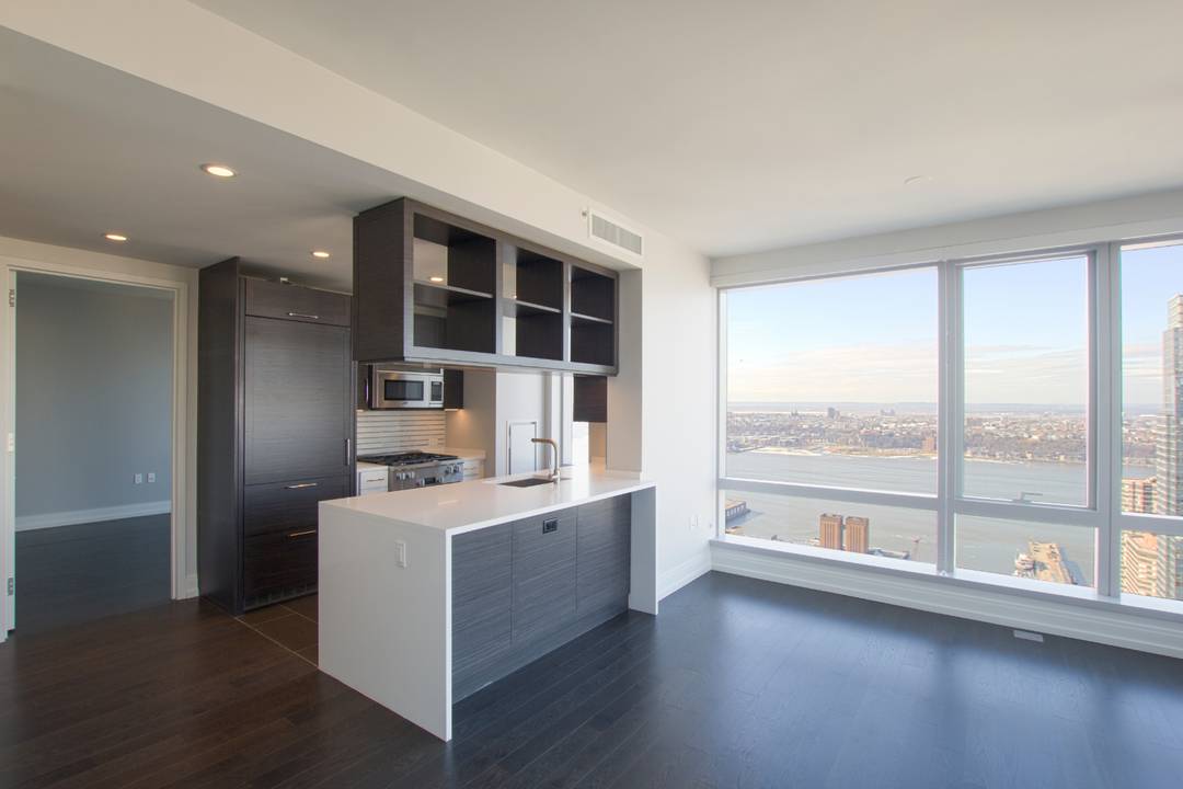 With sweeping views of the city from sunrise to sunset 555TEN towers over the new West Side.