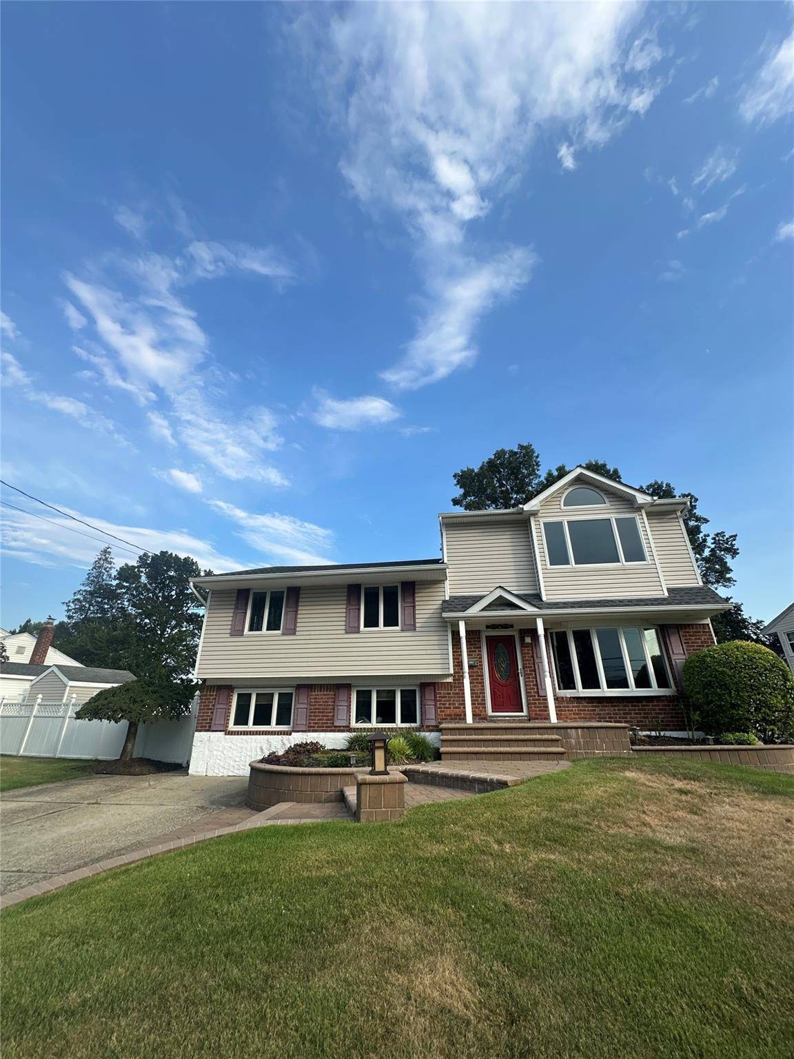 Experience modern comfort in this beautiful split level home situated in a prime Jericho location.