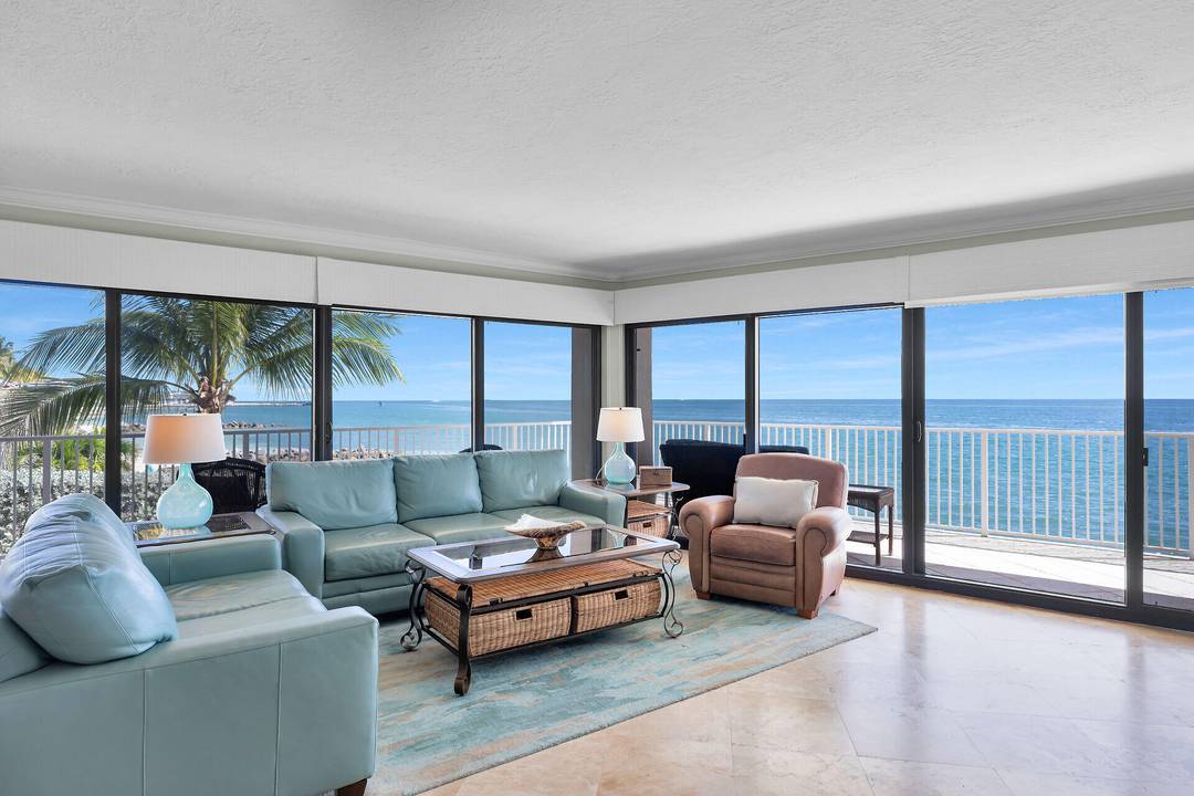 Exquisite high end corner residence offering breathtaking, unobstructed views of the Atlantic Ocean and the pristine beaches of Key Colony Beach.