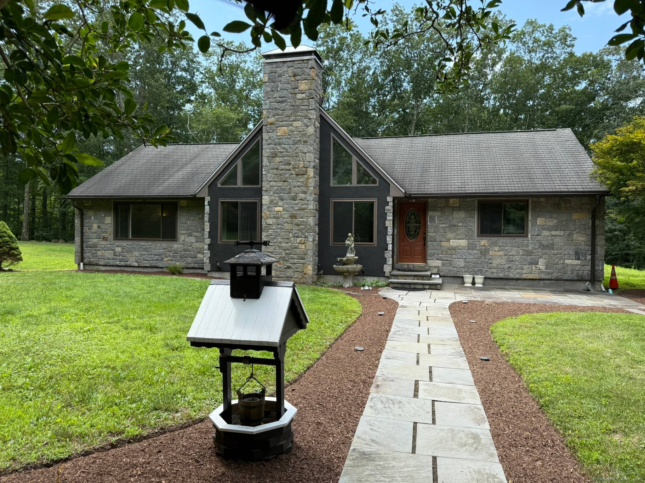 Privacy abounds in this beautifully maintained single family home set on over 2 acres of serene land.