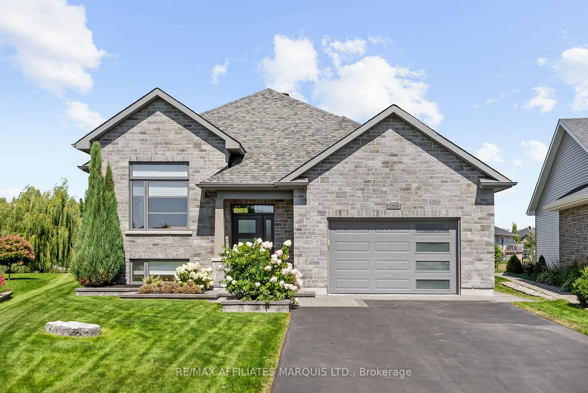 Welcome to 2169 Tremblay, a sophisticated home built in 2016 that combines modern elegance with thoughtful design.