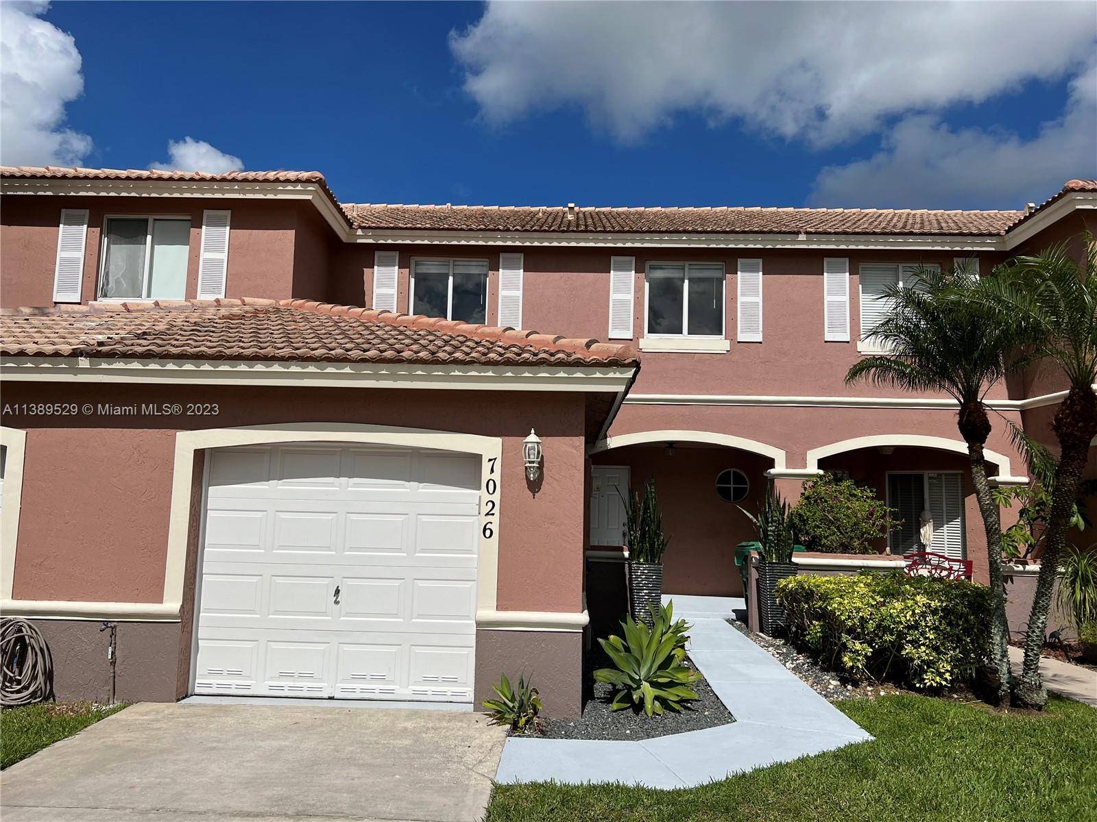 Stunning 2 story Townhome with beautiful lake views on the West Kendall Lake Avila community.