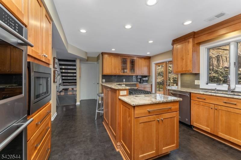 Stunning contemporary in a gorgeous natural setting, with tastefully renovated kitchen and bathrooms.